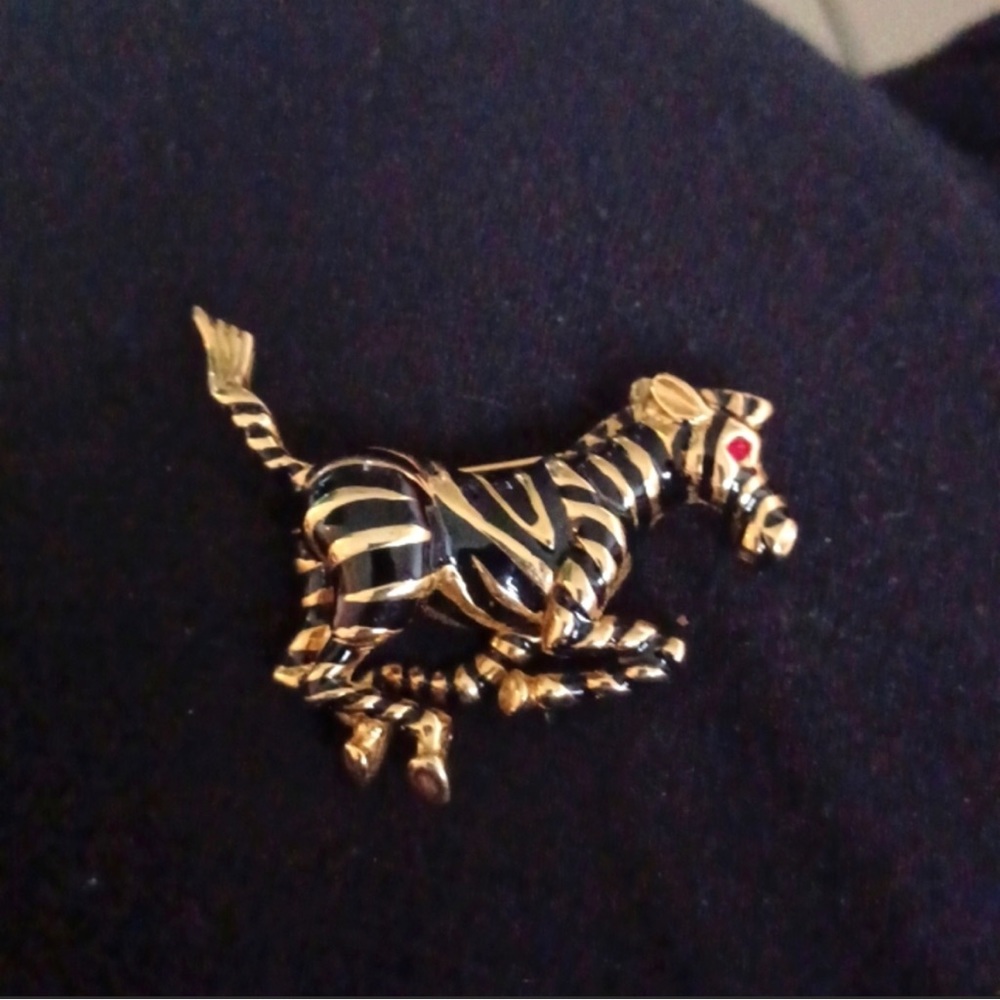 Vintage 3 dimensional gold plated black enamel Zebra with red eye pin brooch